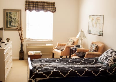 Cozy private room with bed and seating area