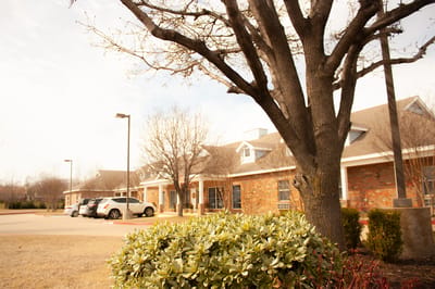 Exterior view of assisted living facility with landscaping