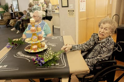 Residents enjoying cupcakes during a gathering.