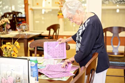Senior resident engaged in a bingo game.