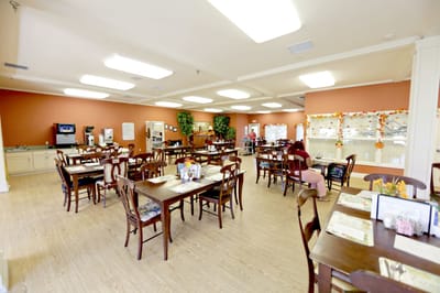 Spacious dining room with wooden tables and chairs