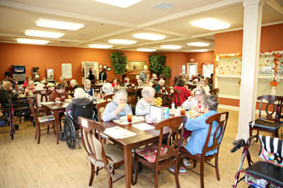Residents enjoying a meal in the dining room.