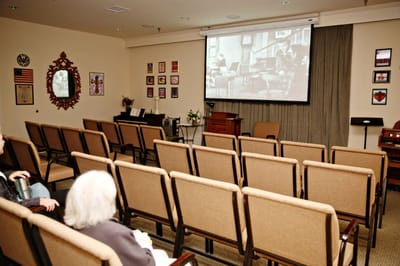 Seating area with people watching a film