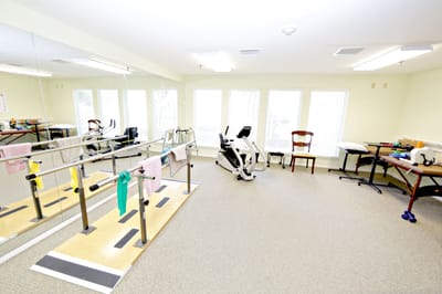 Rehabilitation area with exercise equipment.