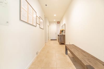 Bright interior hallway with framed documents