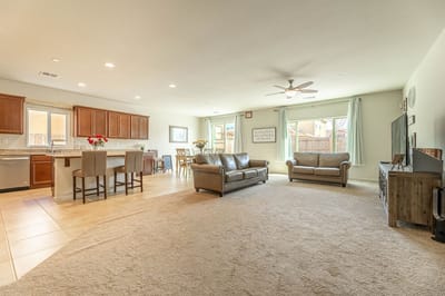Bright common area with living space and dining table.