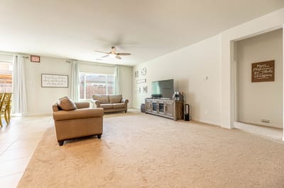 Bright common area with seating and TV
