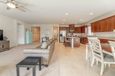 Spacious common area with living room and dining space