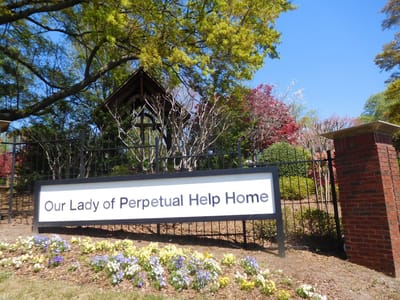 Sign for Our Lady of Perpetual Help Home entrance