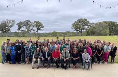 Group photo of staff members outdoors