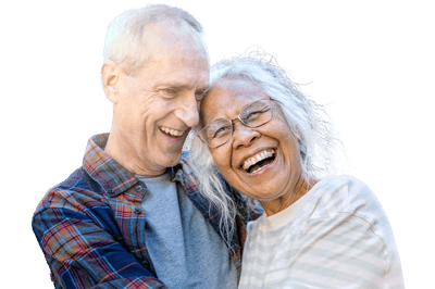 Two seniors laughing and embracing each other