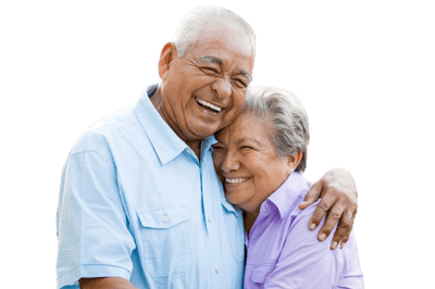 Elderly couple embracing and smiling joyfully