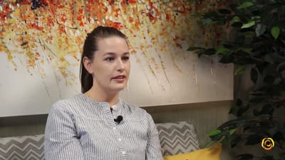 Young woman speaking in a modern interior