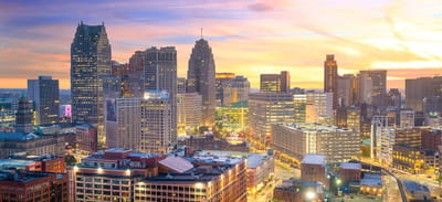 Skyline view of a city at sunset.
