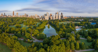 Aerial view of a city park with skyline