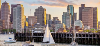 City skyline with boats in the foreground.