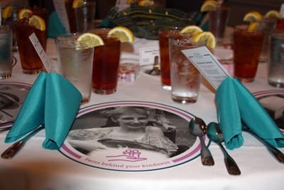 Table setting with drinks and decorative menus.