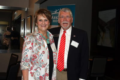 Two people smiling in a common area
