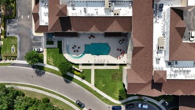 Aerial view of the facility with pool and outdoor space