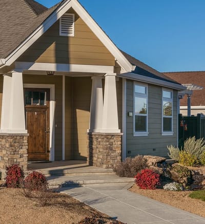 Exterior view of a residential building with landscaped garden