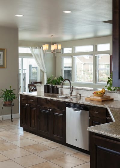 Modern kitchen with granite counters and natural light
