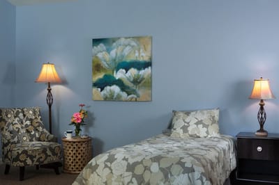 Cozy resident room with floral decor and furnishings