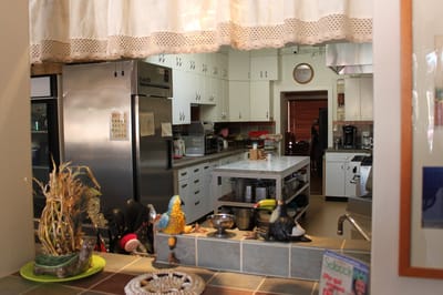 Bright kitchen area with cooking appliances and decor