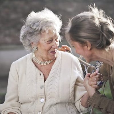 Woman engaging with a senior resident