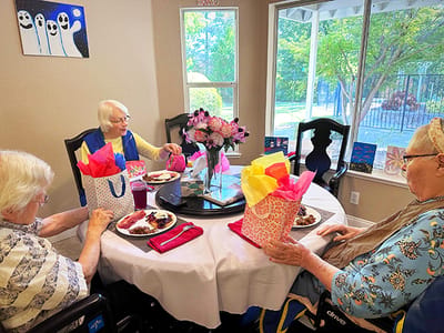 Residents enjoying a meal together at a table