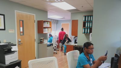 Staff working in a common area of the facility