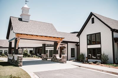 Building entrance with covered area and landscaping