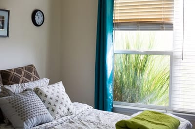 Cozy resident room with a bed and natural light