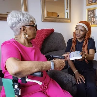 Resident receiving care from staff member