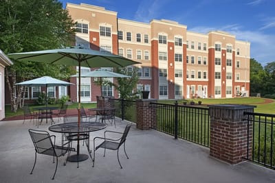 Outdoor seating area with views of the facility building