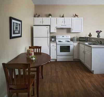 Cozy resident kitchen area with dining table