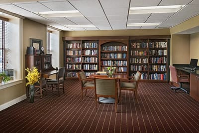 Cozy library space with bookshelves and seating