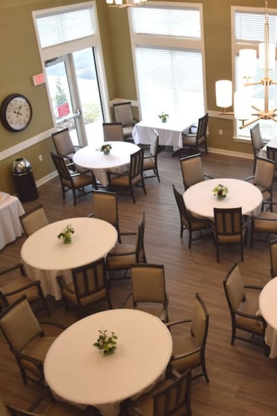 View of a dining room with tables set for meals