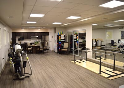 Interior view of a rehabilitation exercise area with equipment