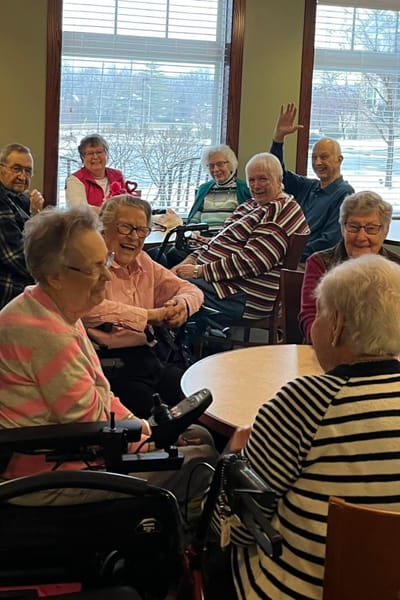 Residents engaged in conversation in a common area