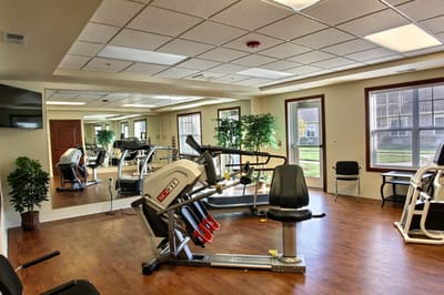 Fitness equipment in an exercise room with mirrors