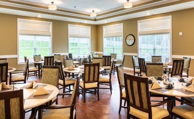 Dining area with neatly arranged tables and chairs