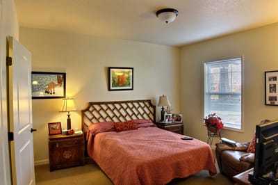 Cozy private room with bed and seating area