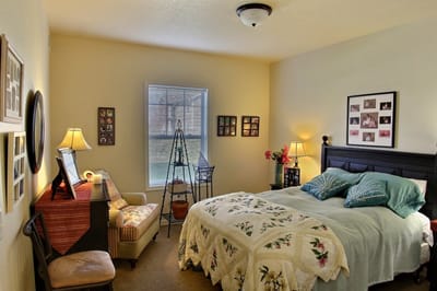 Cozy resident room with bed and personal decor