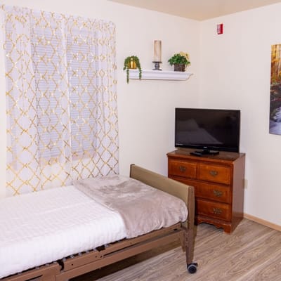 Cozy private resident room with bed and TV