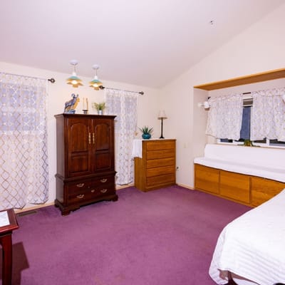 A bright and simple resident room with furniture