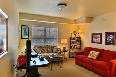 Cozy living room with red couch and decor