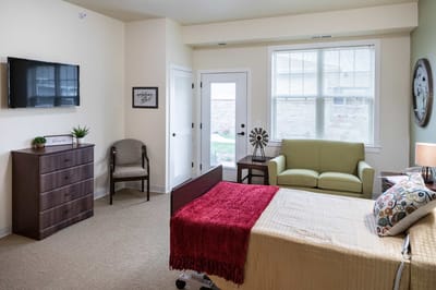 Comfortable resident room with a bed and seating area