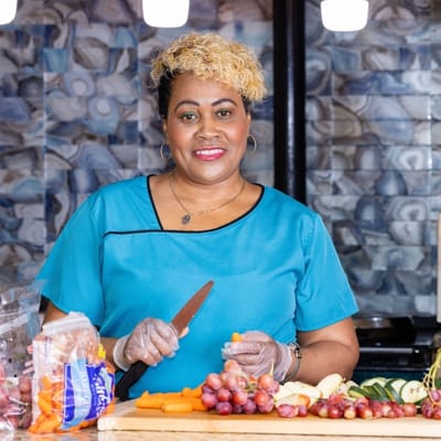 Staff member preparing fresh food in the kitchen
