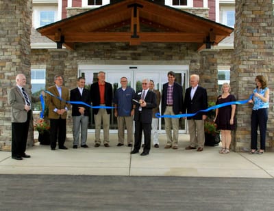 Ribbon-cutting ceremony at the facility entrance