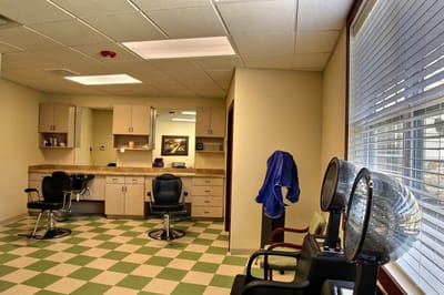 Interior view of a salon area with hair styling chairs